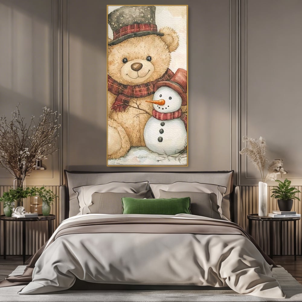 Tablou canvas cu ilustratie cu ursulet si om de zapada, in rama de aluminiu auriu, pe perete intr-un dormitor